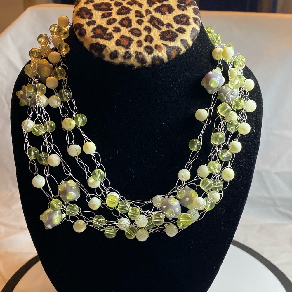 Hand Crafted.  Beads crocheted on white wire.